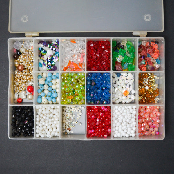 Assorted Plastic Beads in Clear Compartment Container